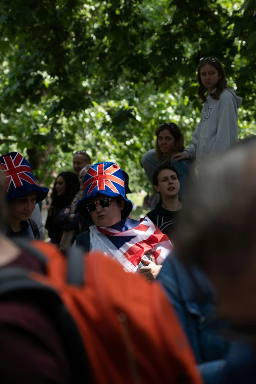 an image of people wearing british hats in a crowd