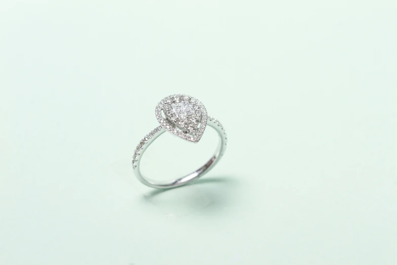 a diamond ring sits on a table