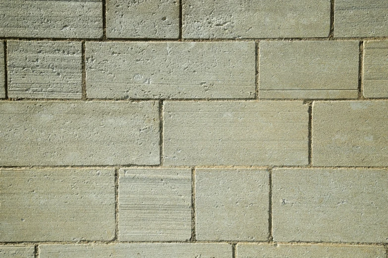 the corner of a wall made of gray bricks
