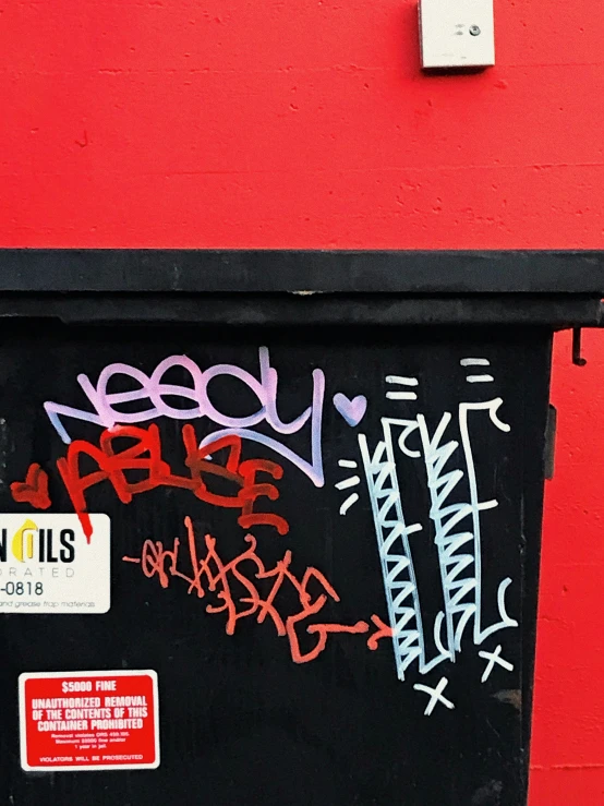 a black board with red letters and stickers all over
