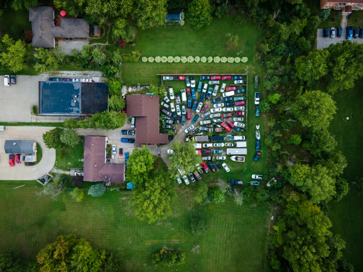 an aerial view of a tennis court and some trees