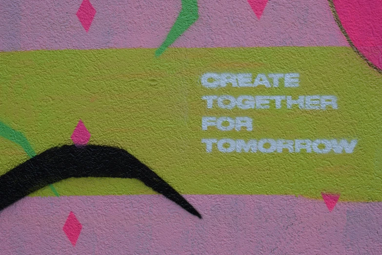 some graffiti on a wall has the words'create together for tomorrow '