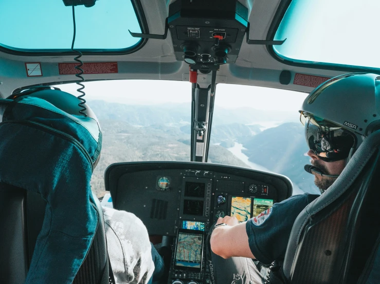 a pilot is flying through the sky on an airplane