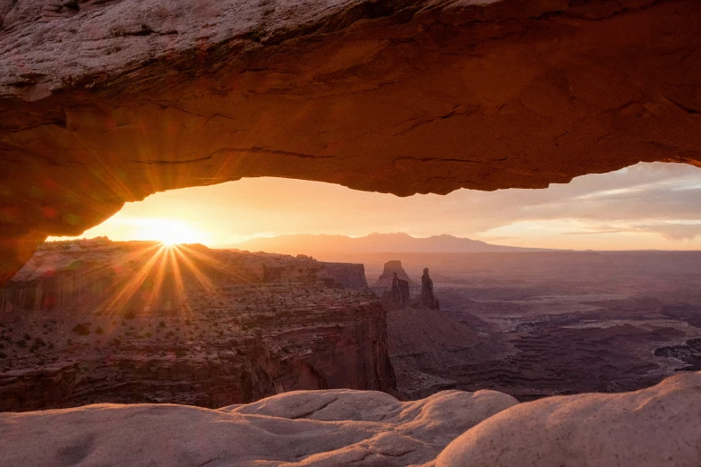 sunlight shining through an opening in the ground