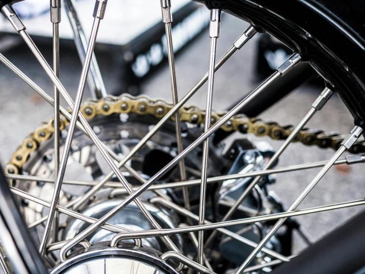 there is a closeup image of a bicycle wheel and chain