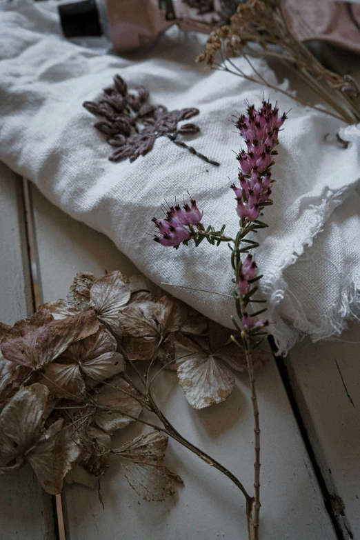 a bunch of flowers sitting on top of a table