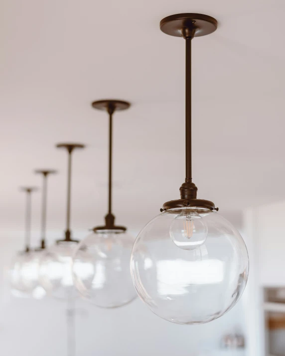 glass globes hang from the ceiling and are suspended by light fixtures