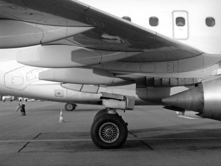 a jet engine sitting on top of an airport tarmac