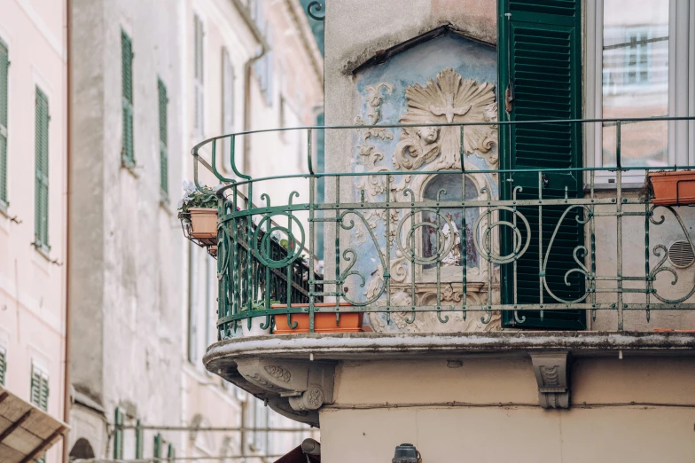 a balcony with planters and a fire hydrant