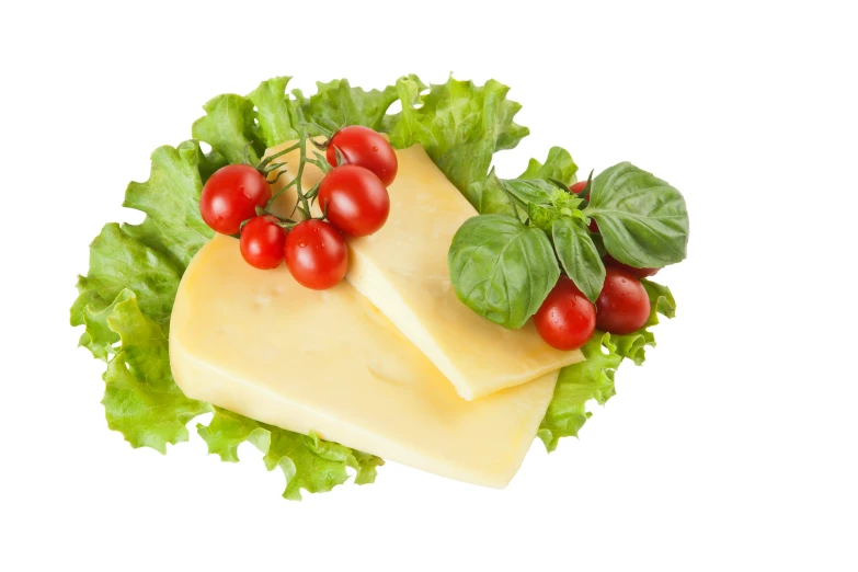 some cheese and lettuce are sitting on top of each other