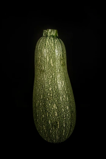 a large green object is shown with dark background