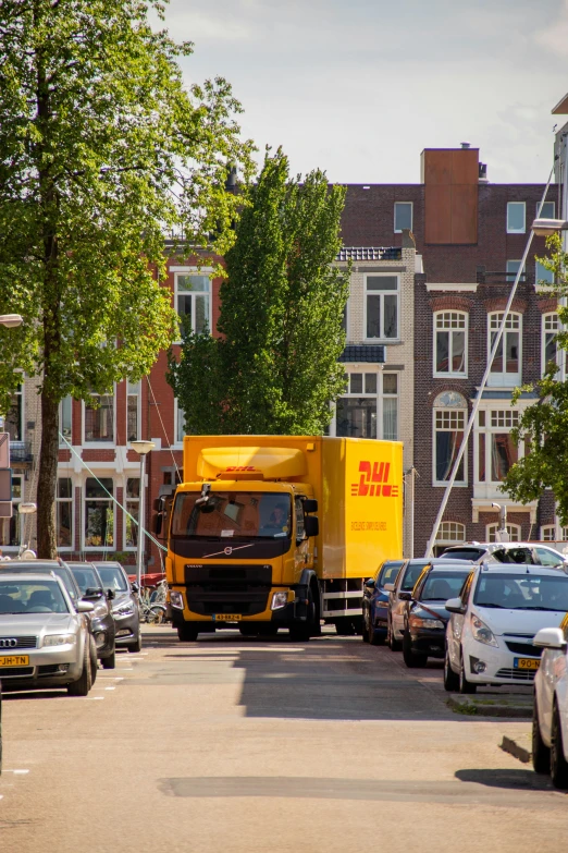 a truck and car are parked on the side of a road