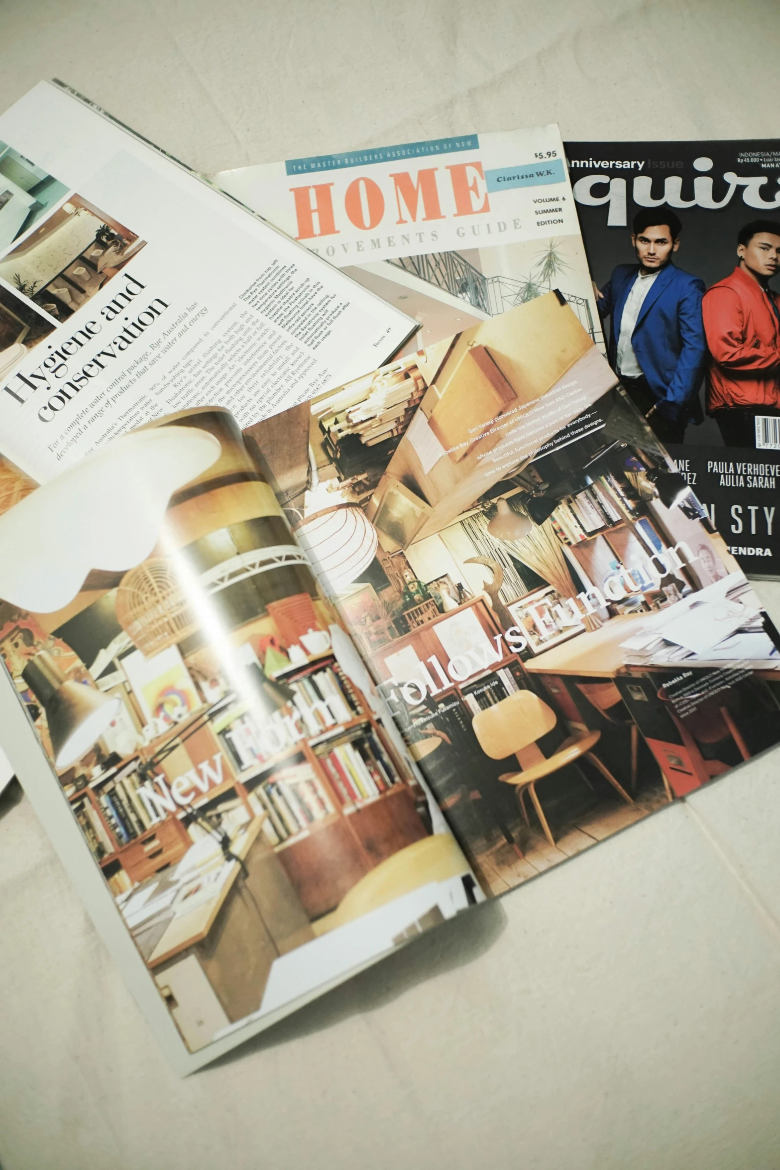 a spread of newspapers sitting on a counter