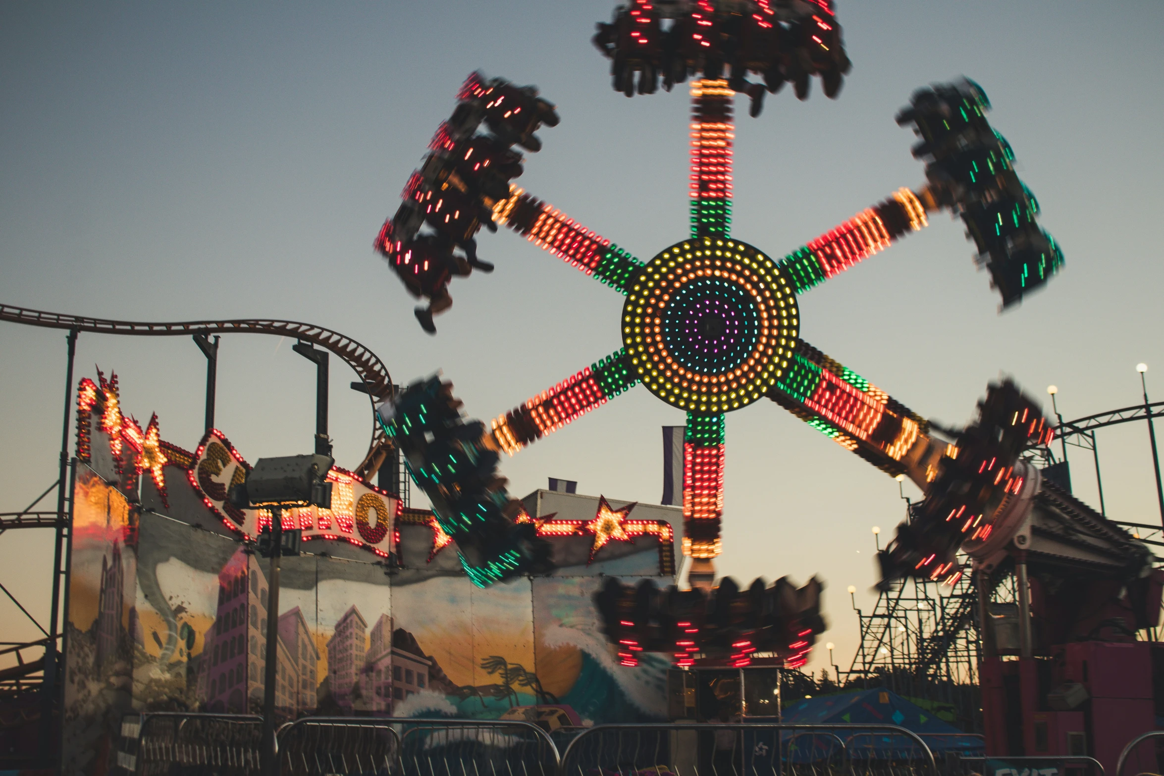 the ferris wheel of a amut park with lights on