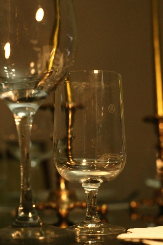 a pair of wine glasses on the table