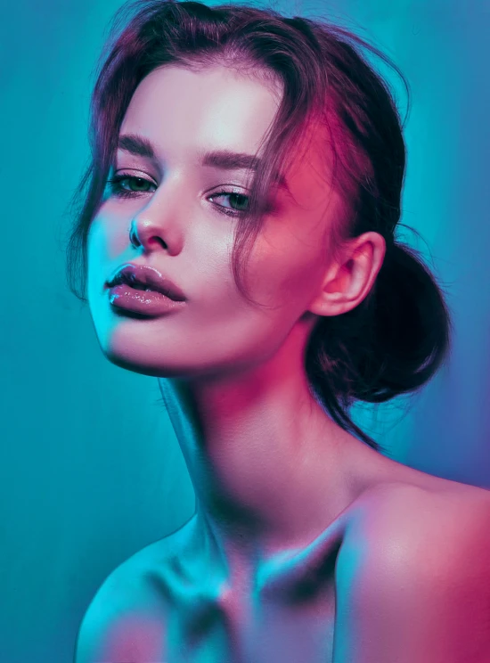 a young woman in a blue background with a light on