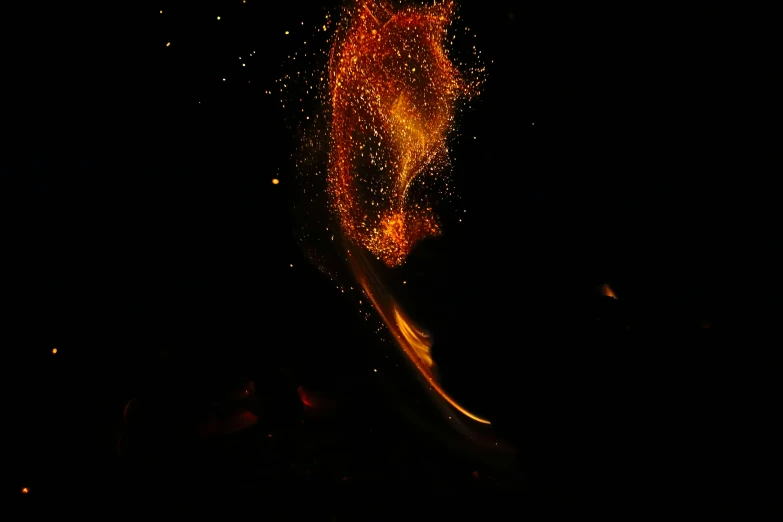 a man performs tricks in the dark on his skis