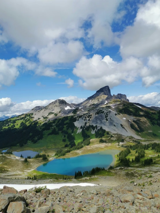 a large mountain with a lake on it