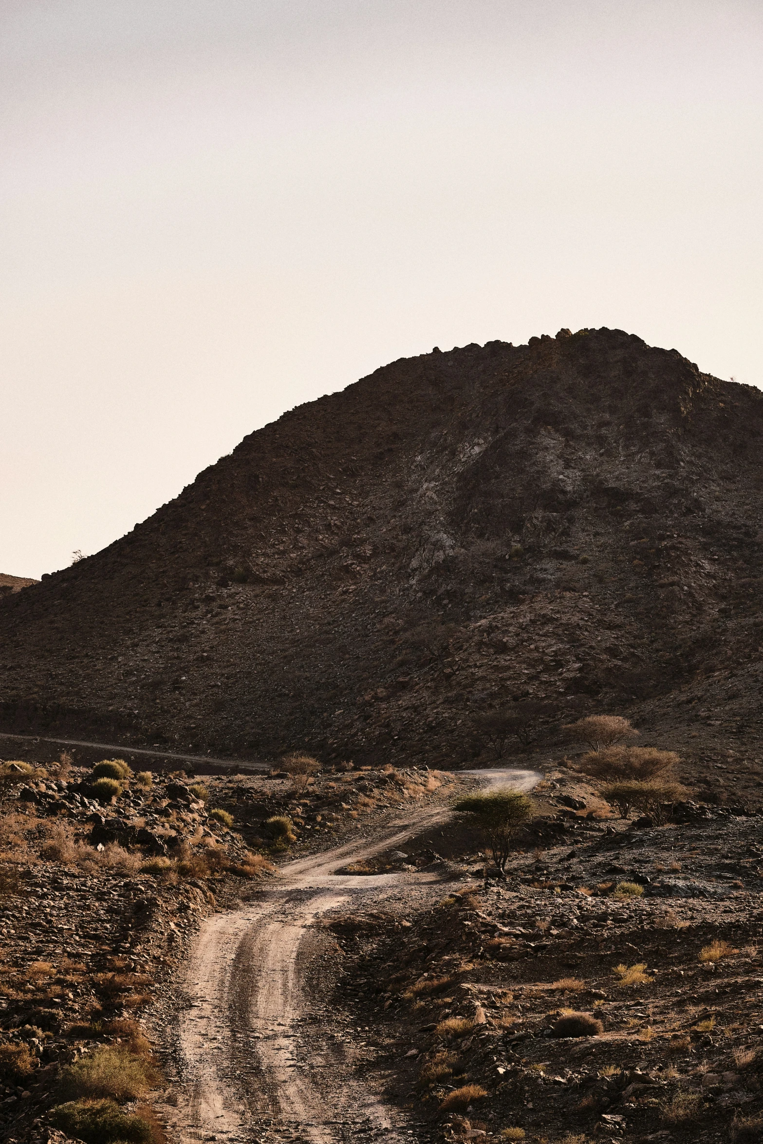 a road passes between two very small mountains