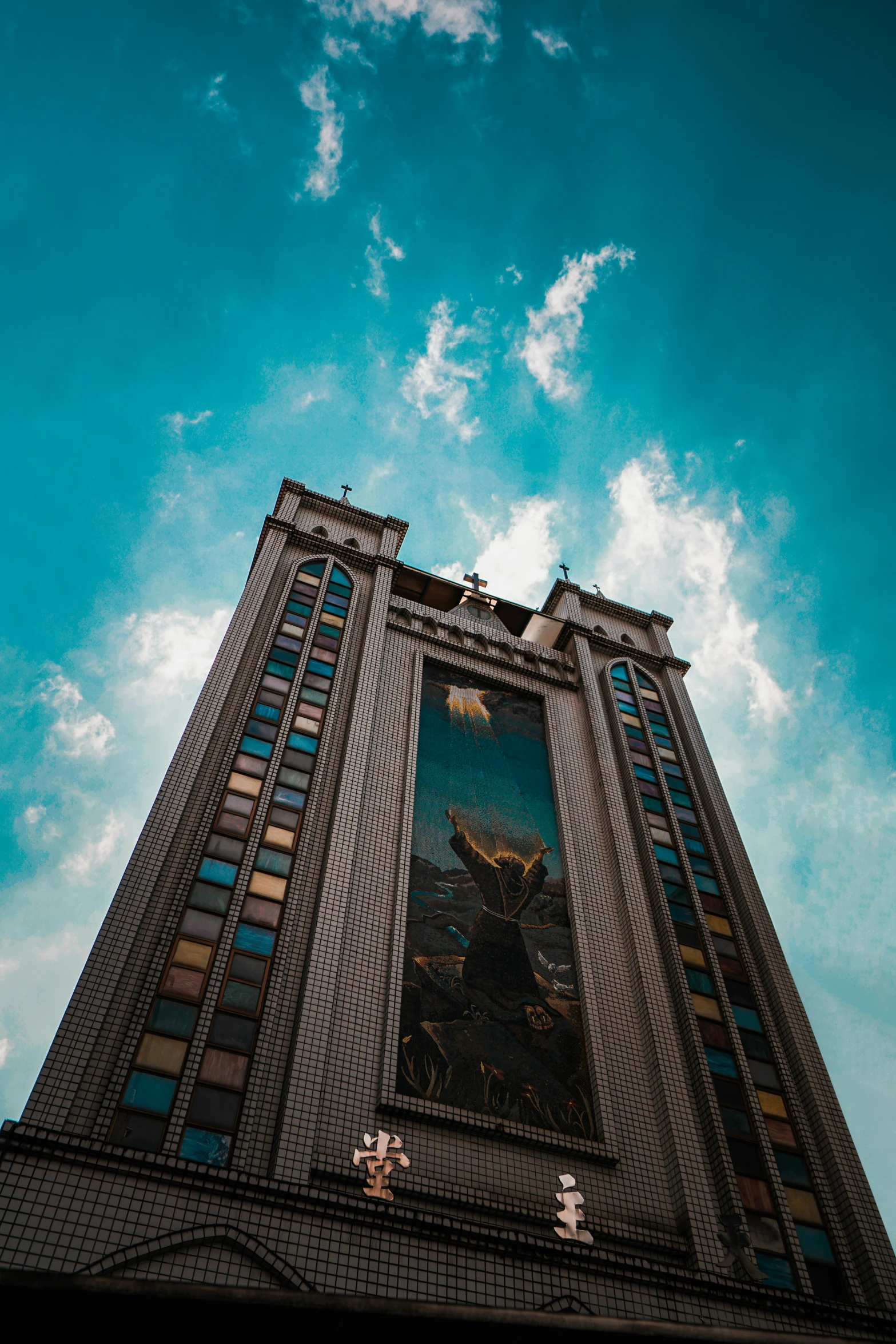 a tall building with a giant stained glass window