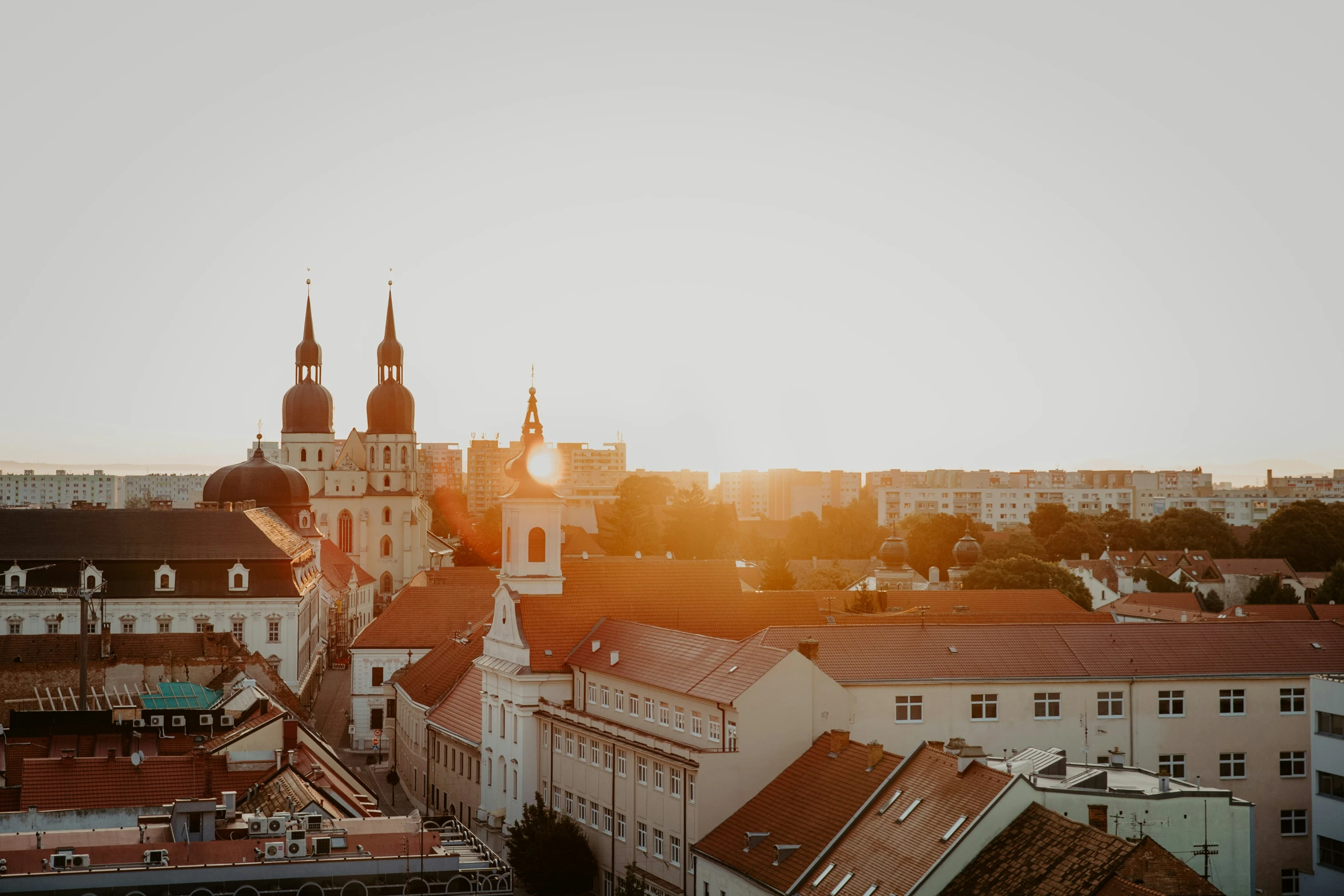 the view of old buildings from atop a hill