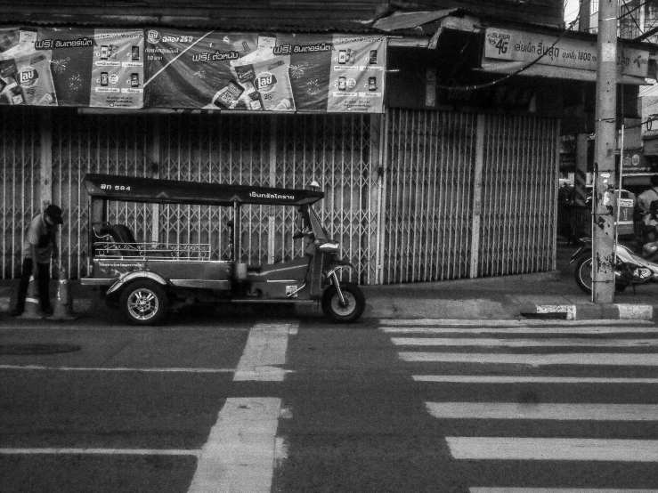 a very pretty car parked in front of a store