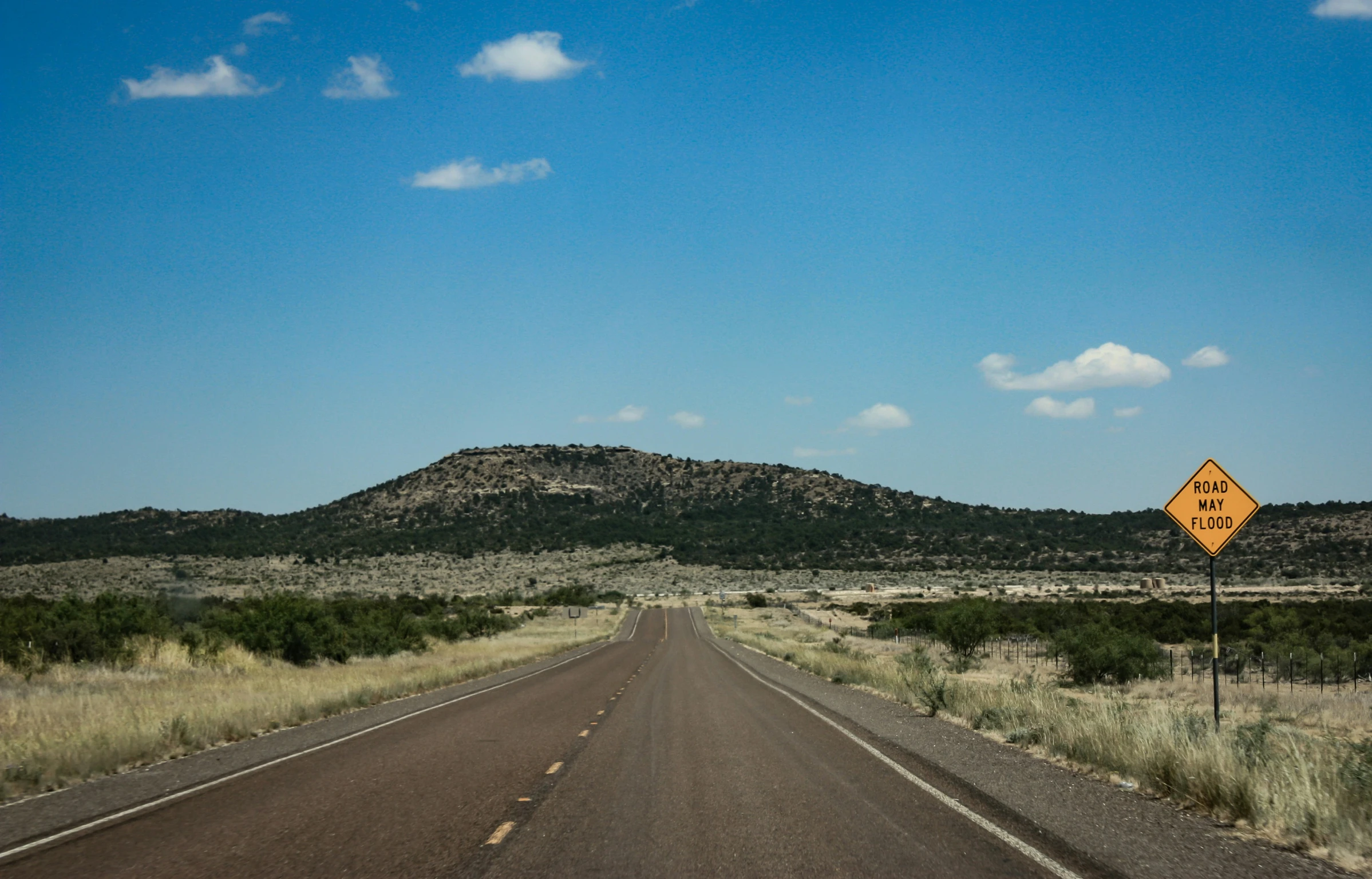 this is a scenic landscape of desert, including mountains