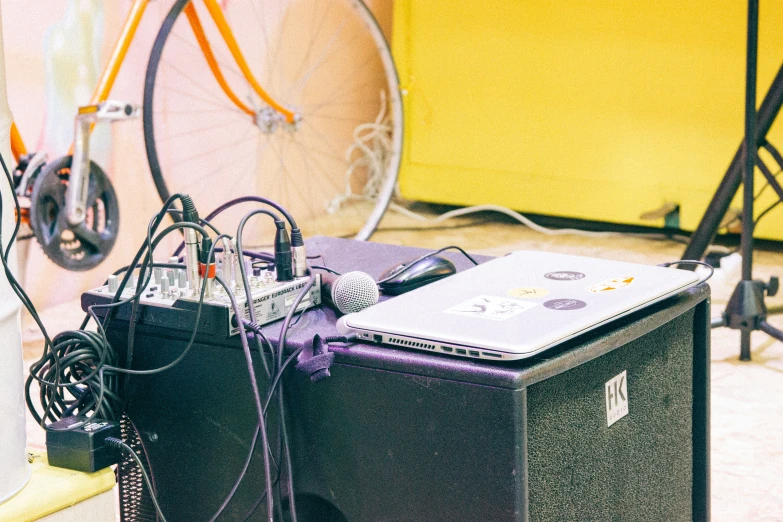 a table with a laptop and many wires