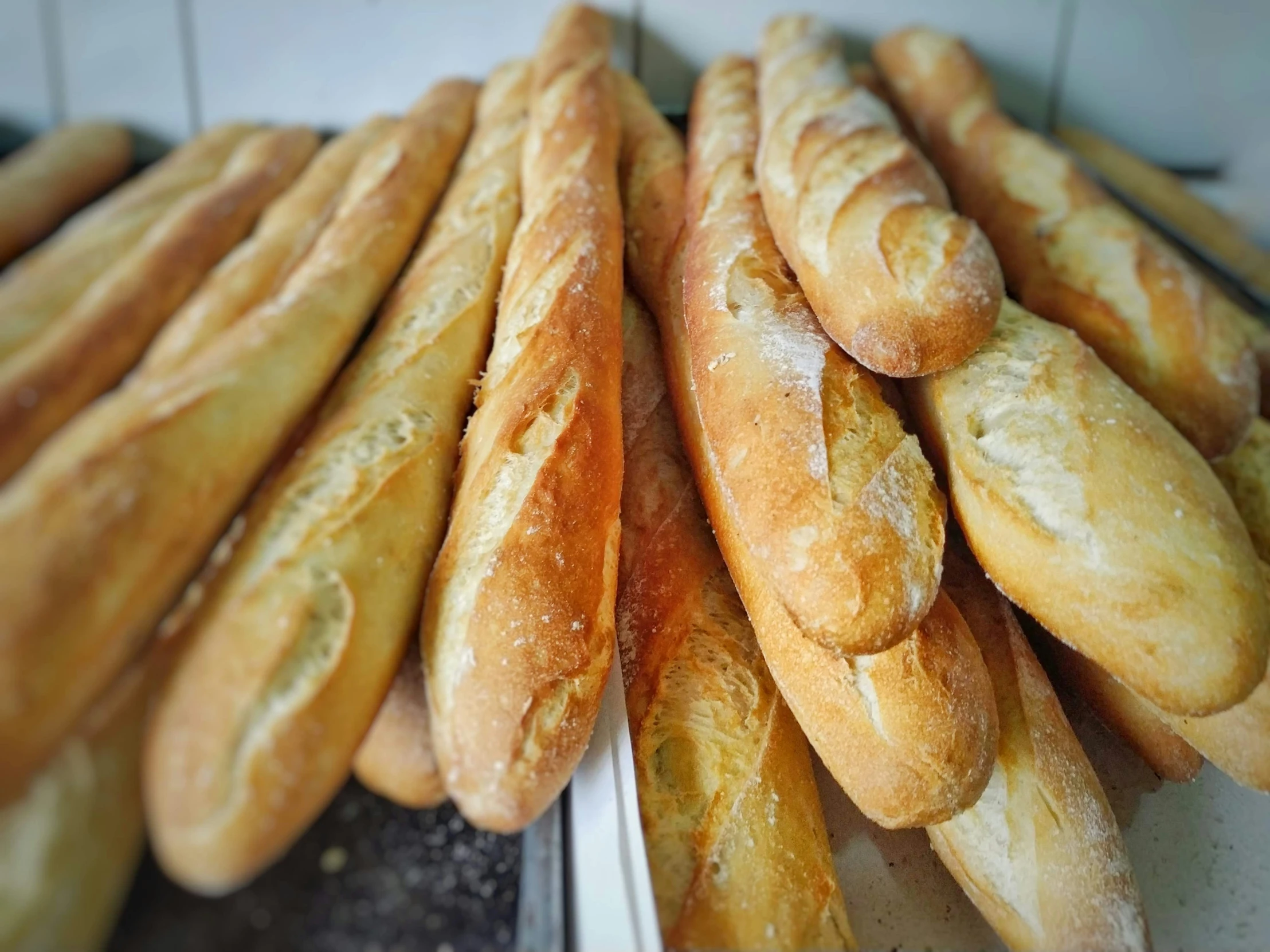 there is several breads sitting on top of the counter