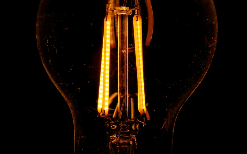 a lighted light bulb with yellow and white light