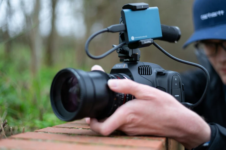 a camera being used to take pictures in the woods