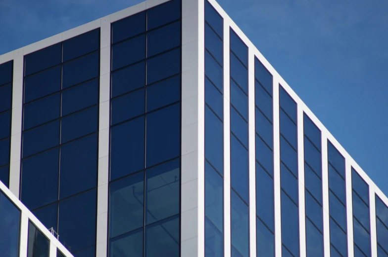 an image of the glass windows on the side of a building