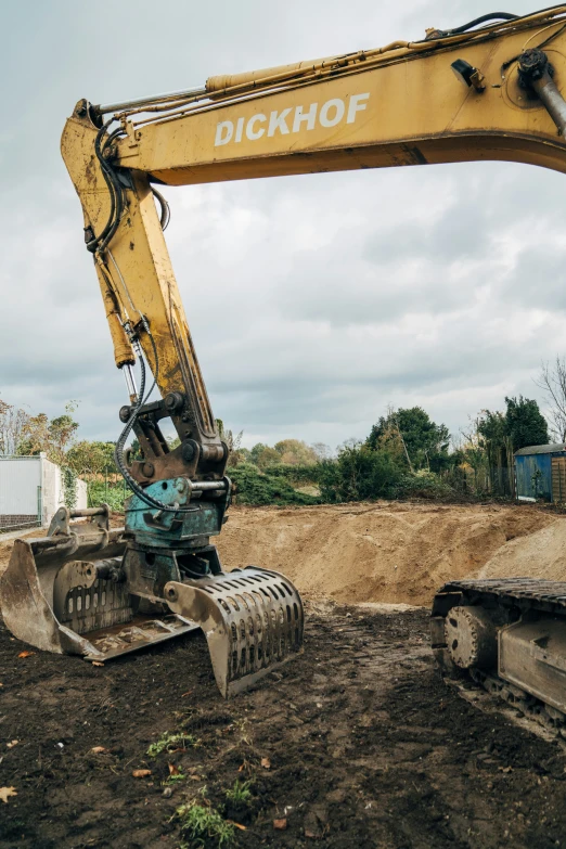 an older backhoe has been removed by a bulldozer