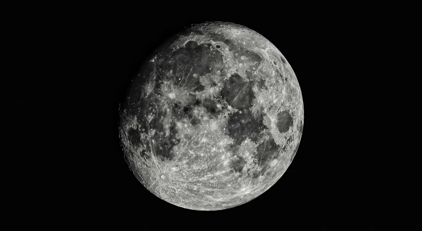 the side of a very large moon with only a few visible lights