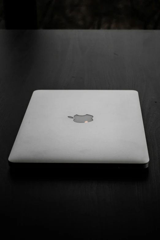 a close up po of an apple laptop