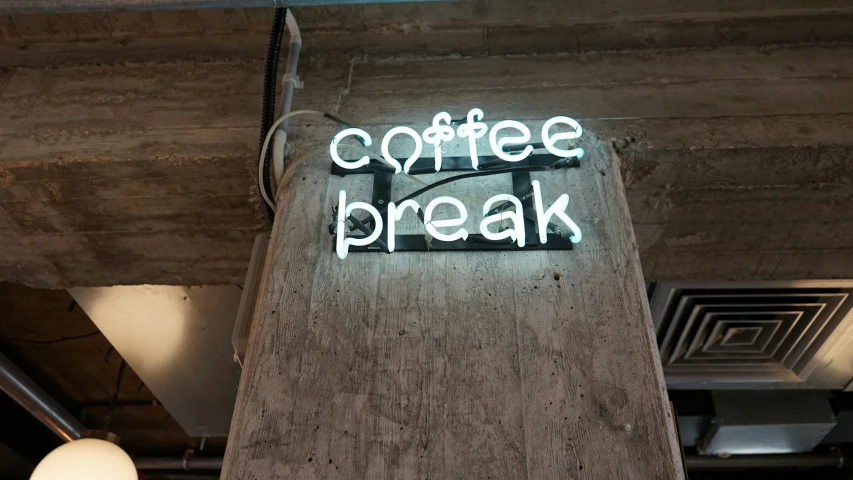 this is a restaurant sign that has been illuminated for a coffee break