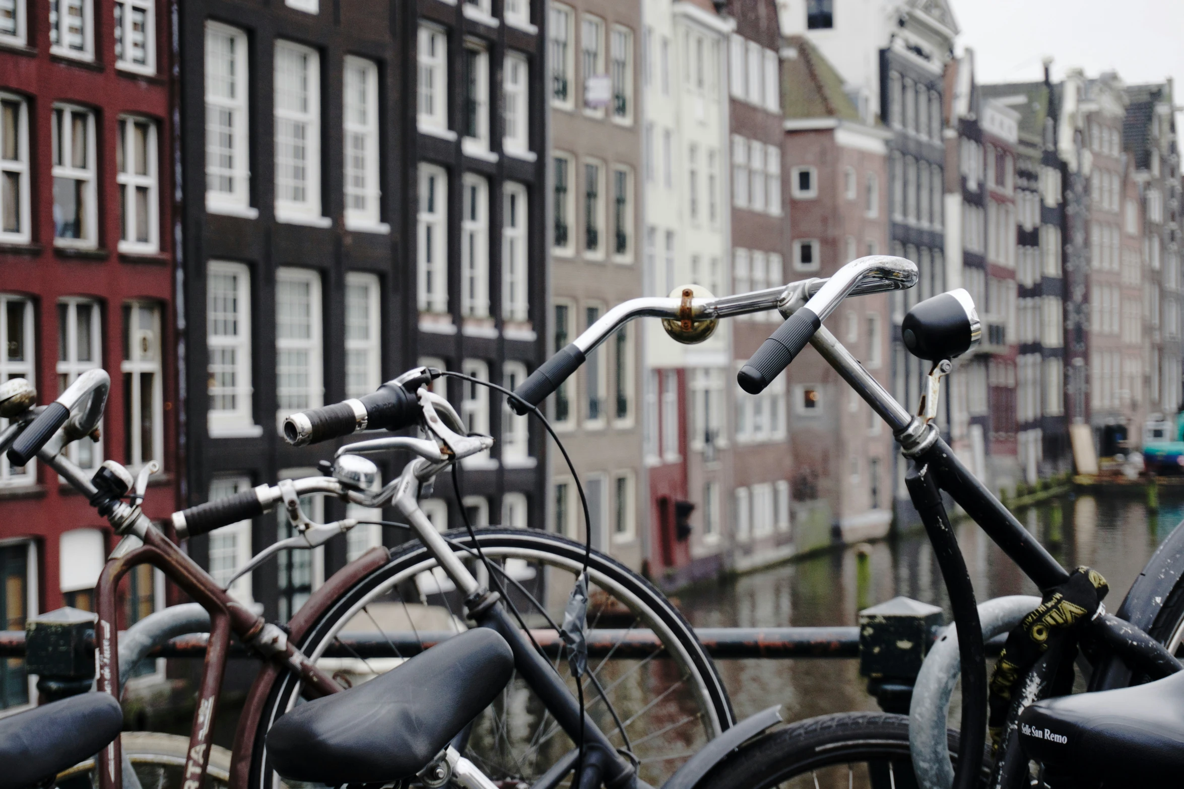 several bicycles parked near each other on the street