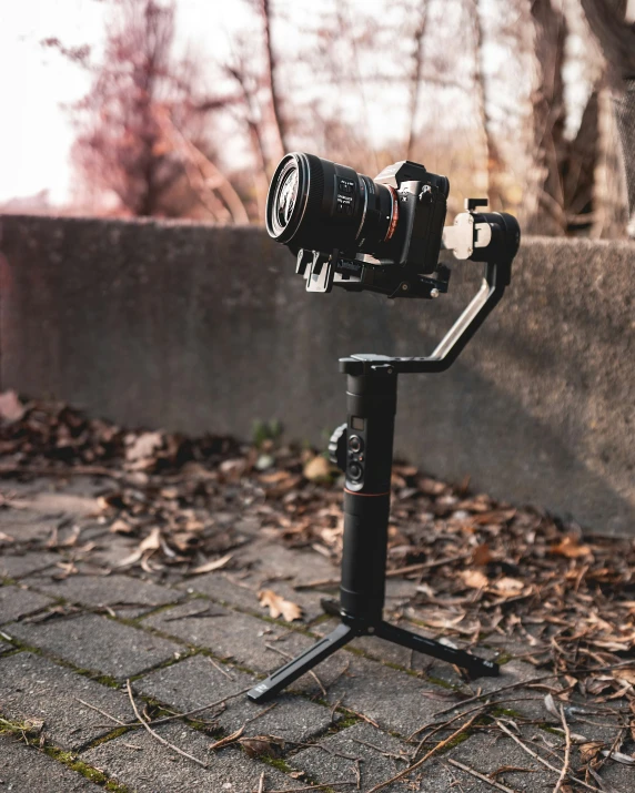 a close up of a video camera mounted on a tripod