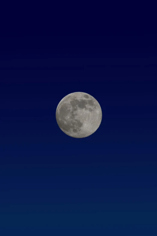 an airplane flies by in front of the moon