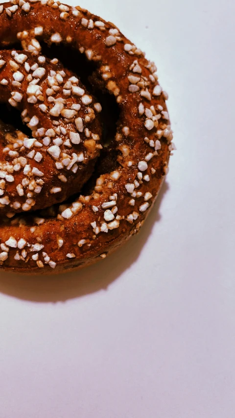 three pieces of bread covered in seeds, including sprinkles