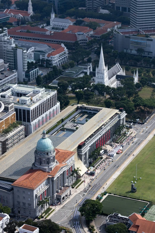 an aerial view of a large building with many buildings around it