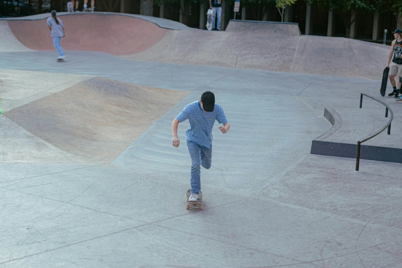 a person riding a skate board on a skate park