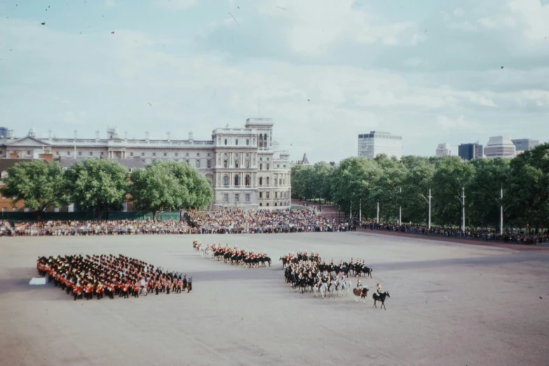 a very large group of people on horses in a circle