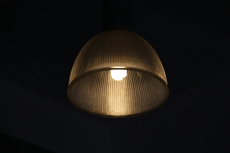 a large brown light hanging from the ceiling