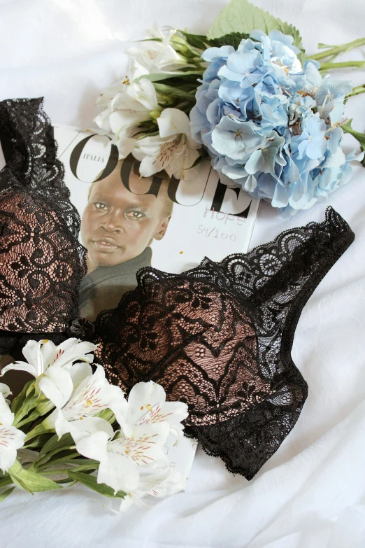 three lace lingerie thongs with flowers and a brooch