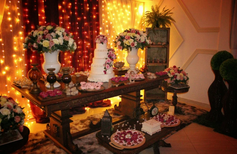 an assortment of cakes are displayed on a table