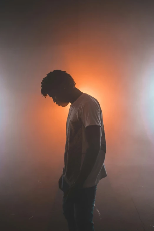 a man is standing on a foggy floor