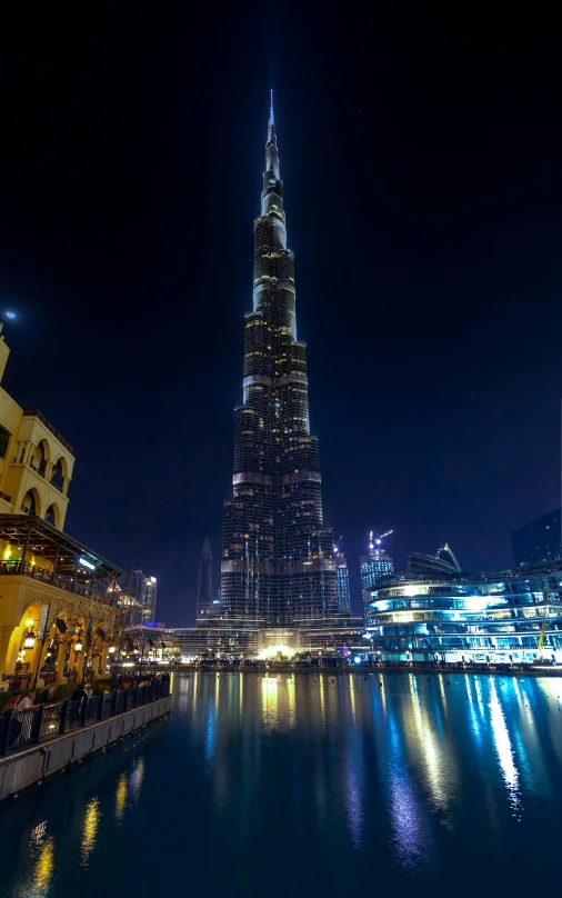 tall skyscr rising high over the city at night