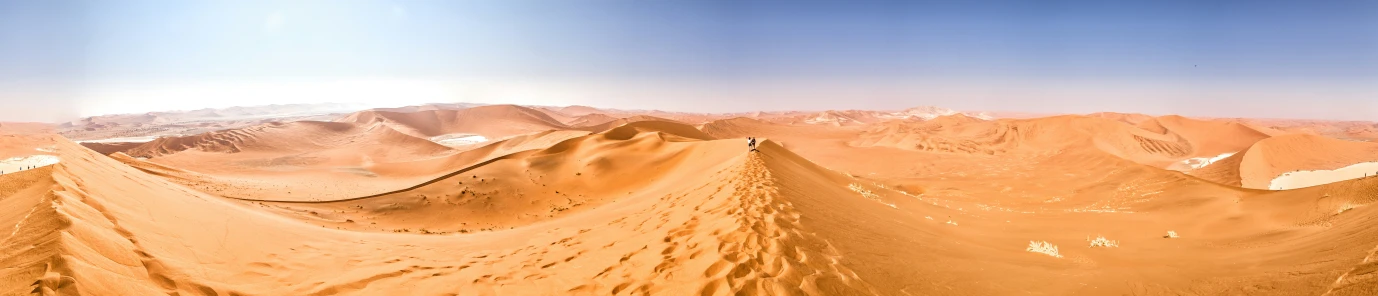 the mountains look like they are growing out of sand