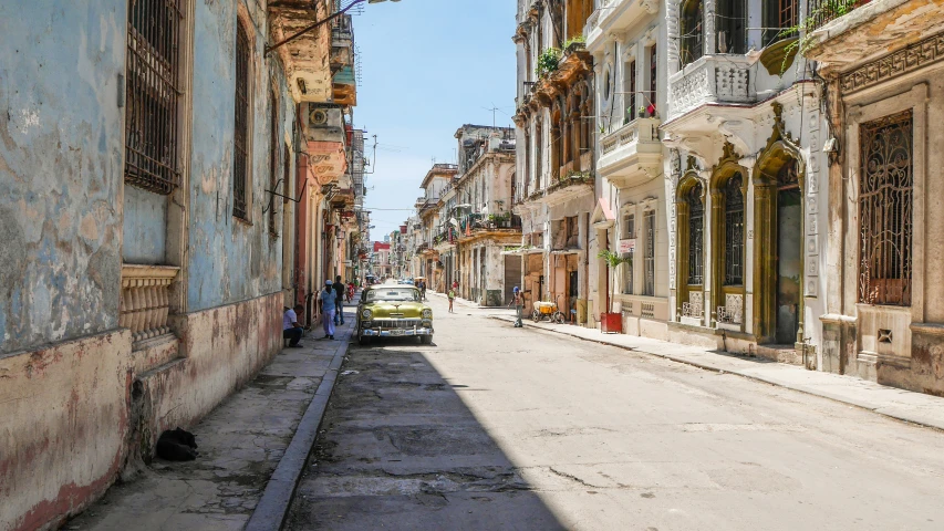 several people are walking along a city street